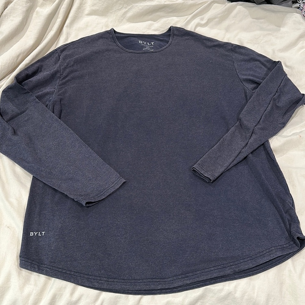 Stonewashed blue men’s size XXL long sleeve drop cut shirt.